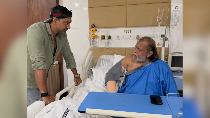 A man visits an elderly patient lying in a hospital bed and shares a heartfelt moment with him.