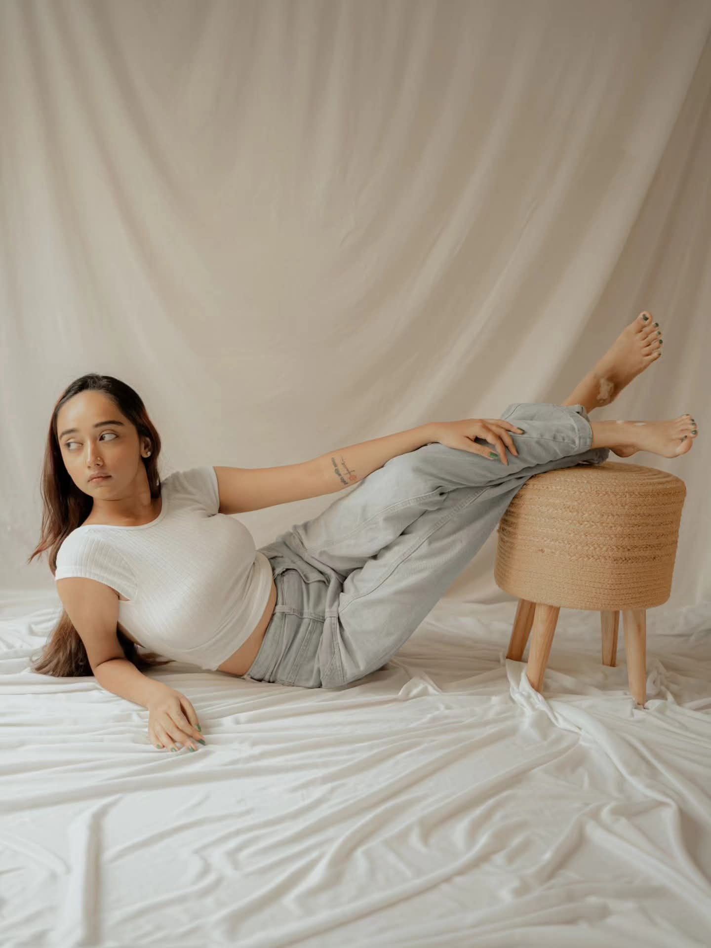 Meghna Ghosh in a relaxed editorial portrait blending contemporary fashion with Bengali sensibility
